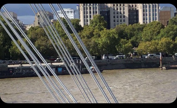 Police vans moving towards Embankment station.
